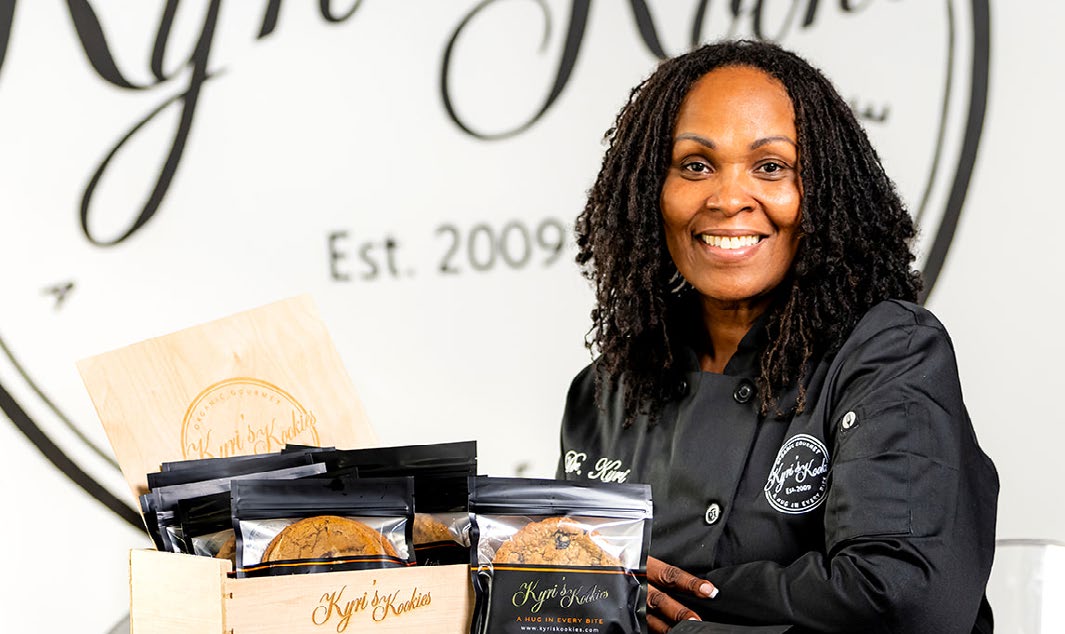 Kyri posing with her cookies, photo courtesy of Dr. Kyri Mosley